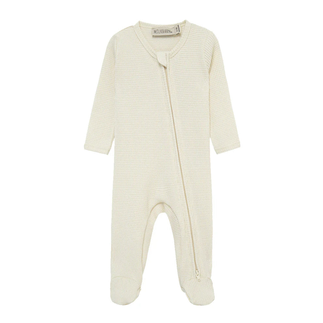 Baby onesie with a zipper on a white background