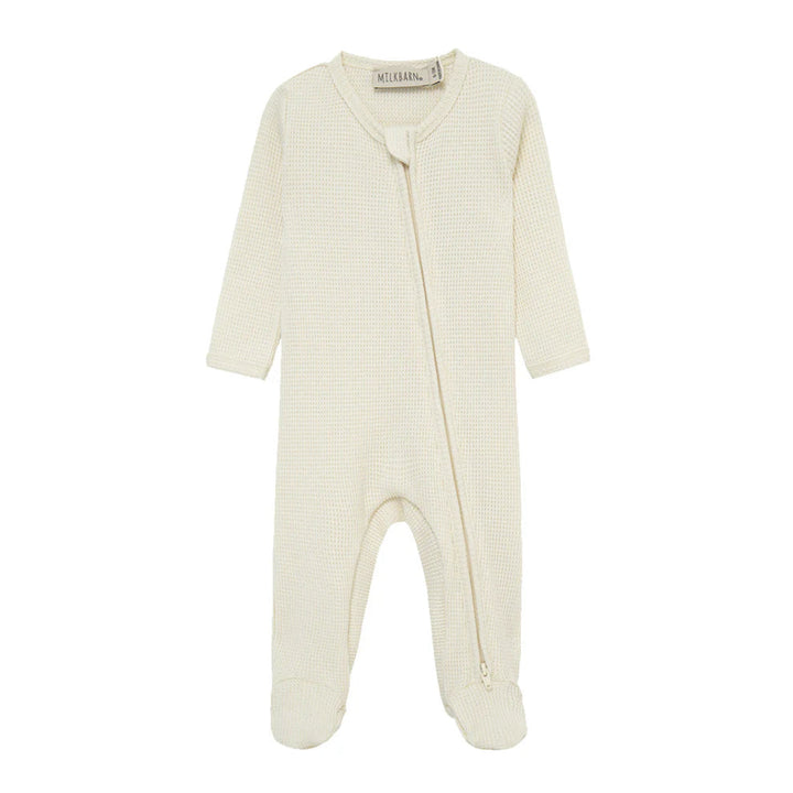 Baby onesie with a zipper on a white background