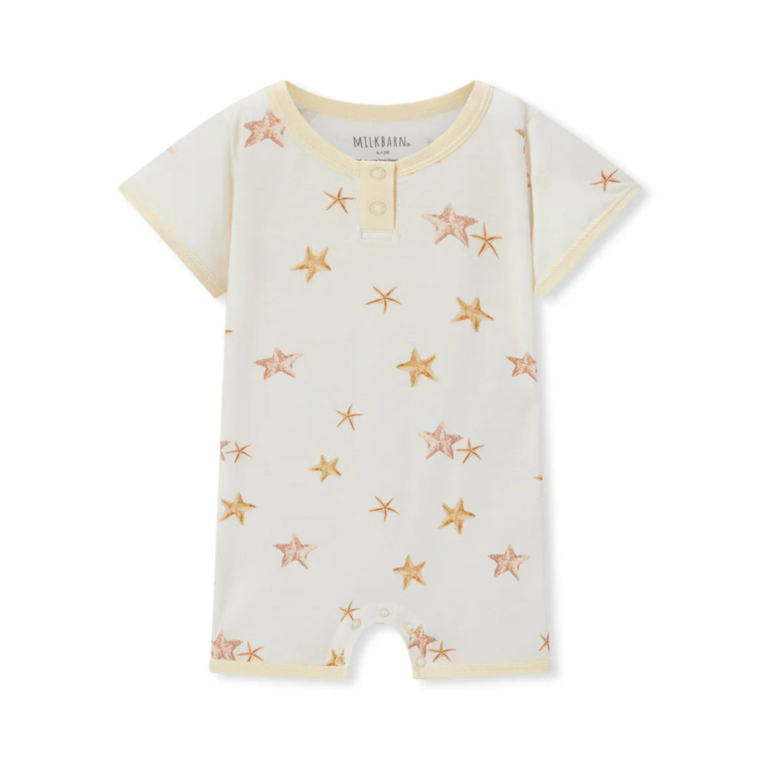 Baby romper with star pattern on a white background