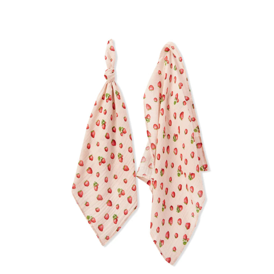 Two pink scarves with strawberry pattern on a white background