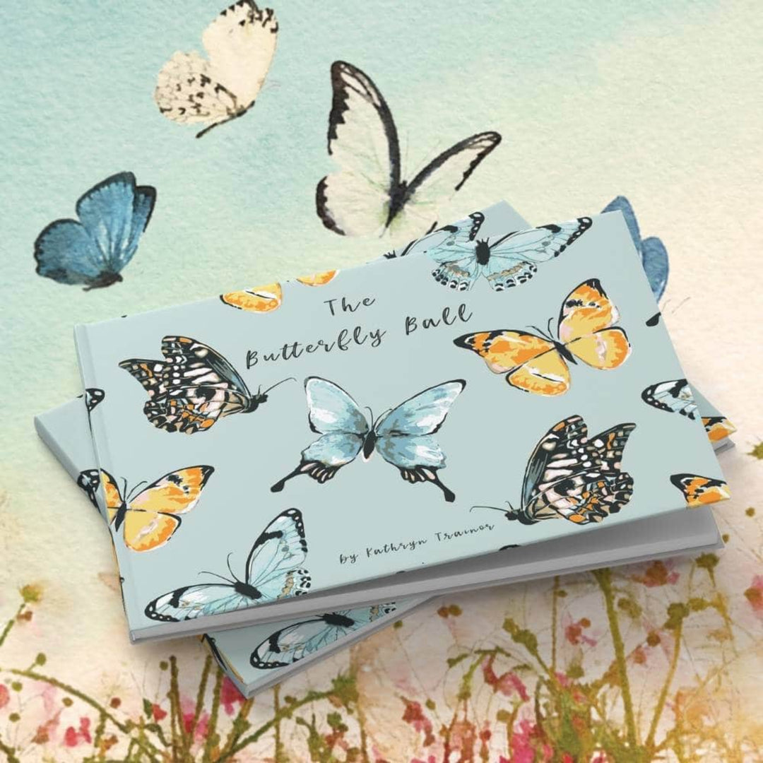 Stack of books titled 'The Butterfly Ball' with butterfly illustrations on a floral background