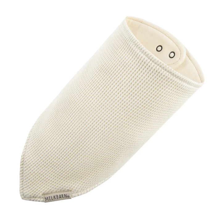 Beige baby wrap with 'Milkbarn' branding on a white background