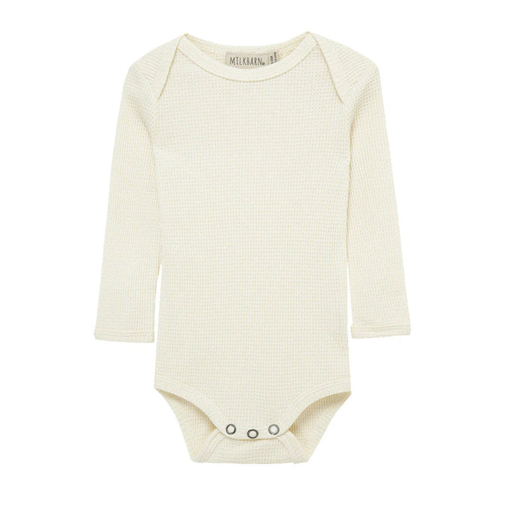White baby bodysuit with long sleeves on a white background