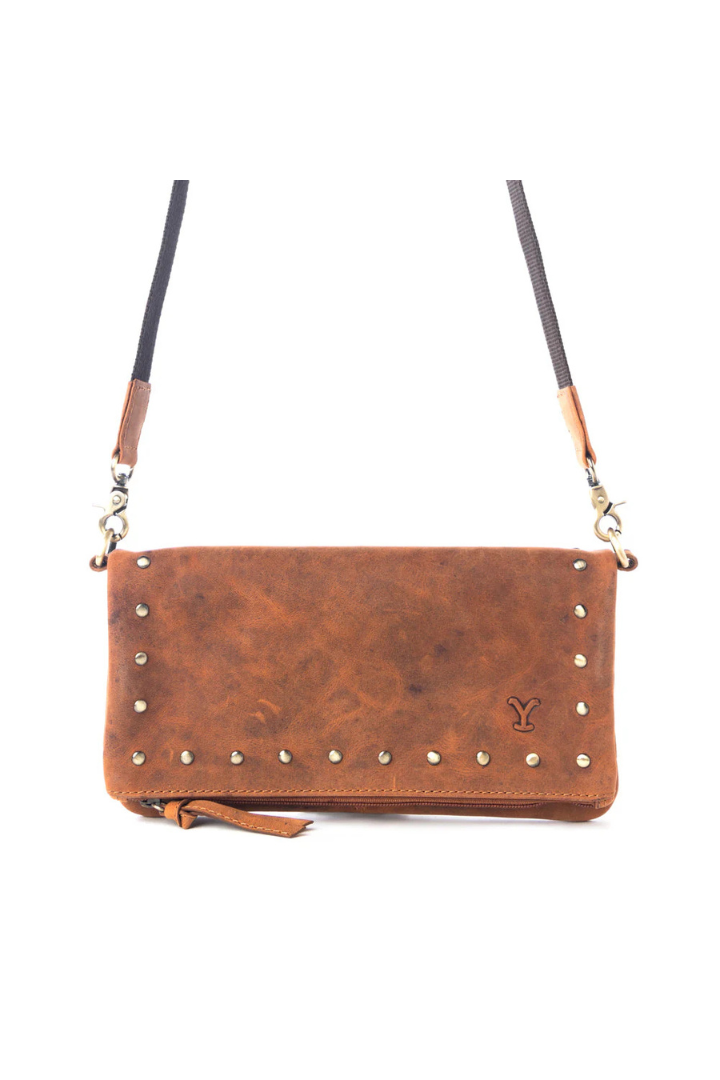 Brown leather crossbody bag with studs on a white background