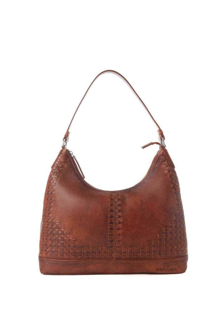 Brown leather handbag with textured surface on a white background
