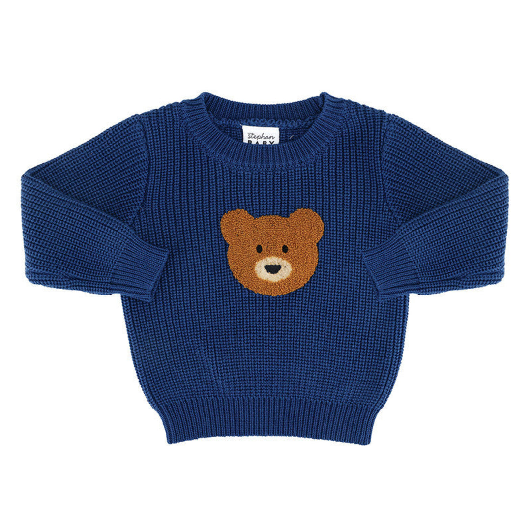 A navy blue ribbed knit baby sweater featuring a brown teddy bear face motif on the chest, displayed flat against a white background.