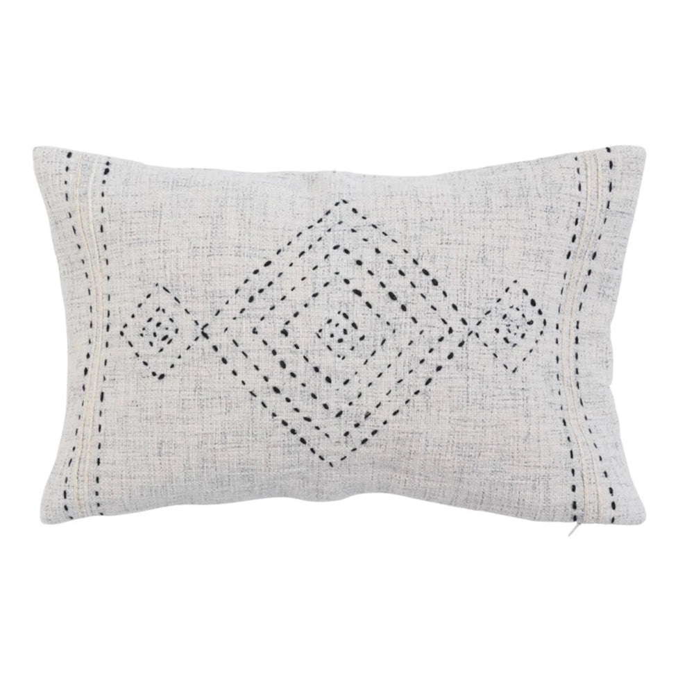 Decorative pillow with geometric pattern on a white background