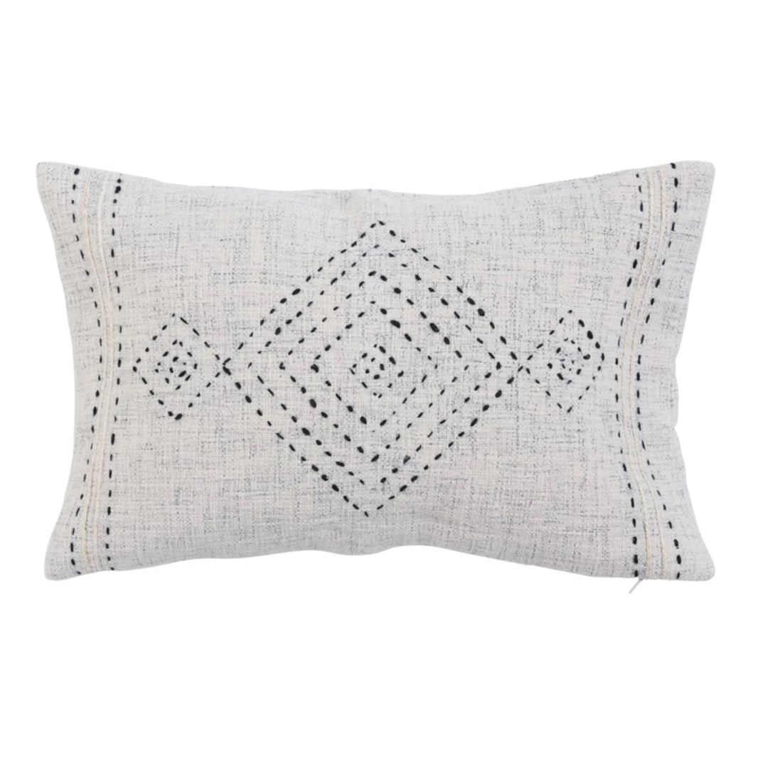 Decorative pillow with geometric pattern on a white background