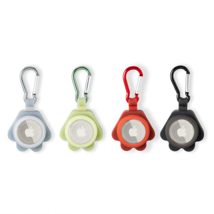 Four colorful air tag holders with carabiners on a white background