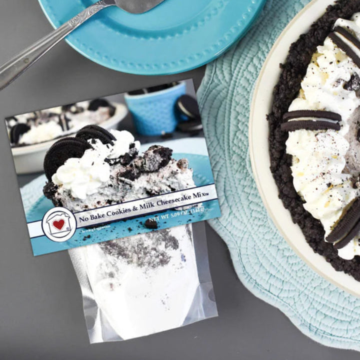 Oreo cheesecake on a plate with a recipe card next to it