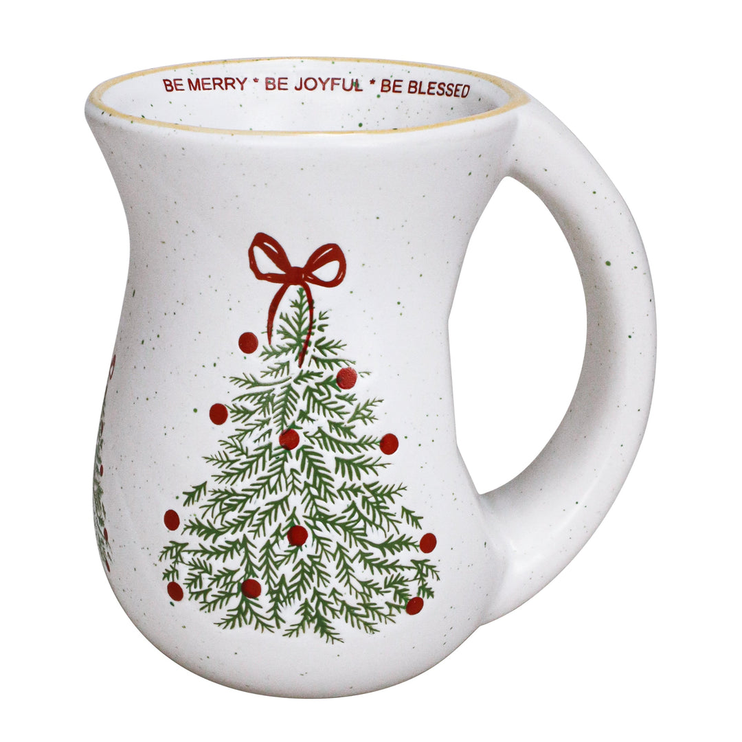 White ceramic mug with Christmas tree design and text on a white background
