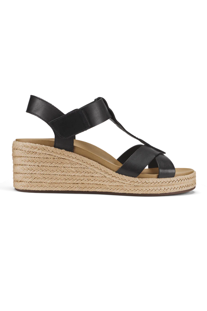 A single women's wedge sandal with black leather straps and a natural jute-wrapped wedge heel, shown in a side profile on a white background.