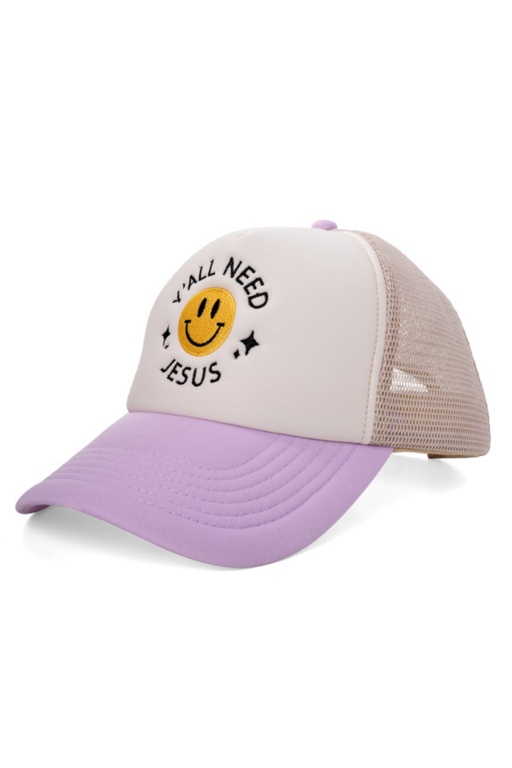 Trucker hat with smiley face and text 'All you need is Jesus' on a white background