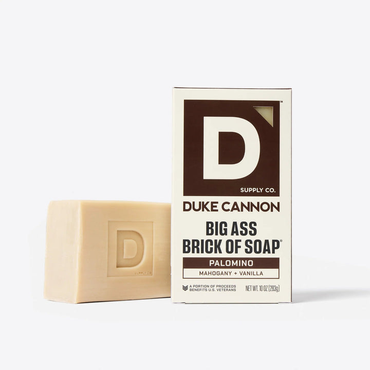 Bar of soap and its packaging with 'Duke Cannon' branding on a white background