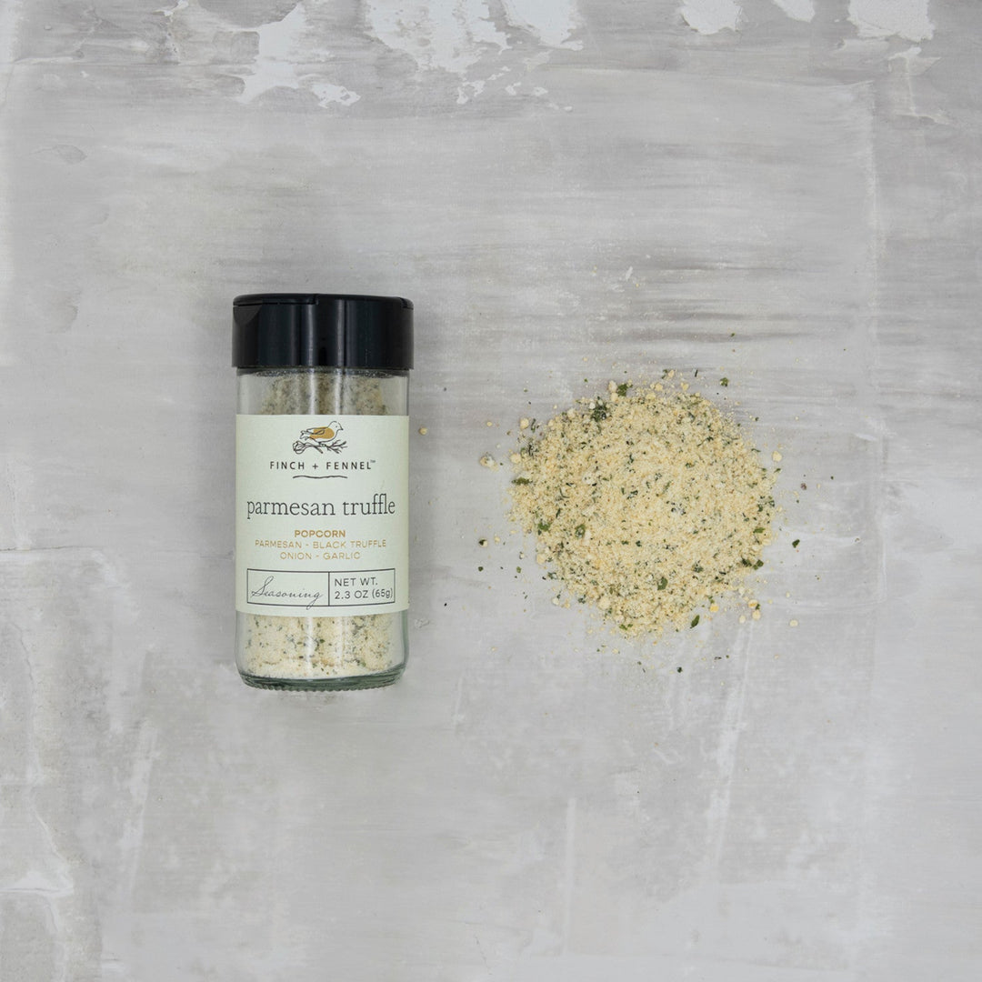 Bottle of parmesan truffle seasoning on a textured gray surface