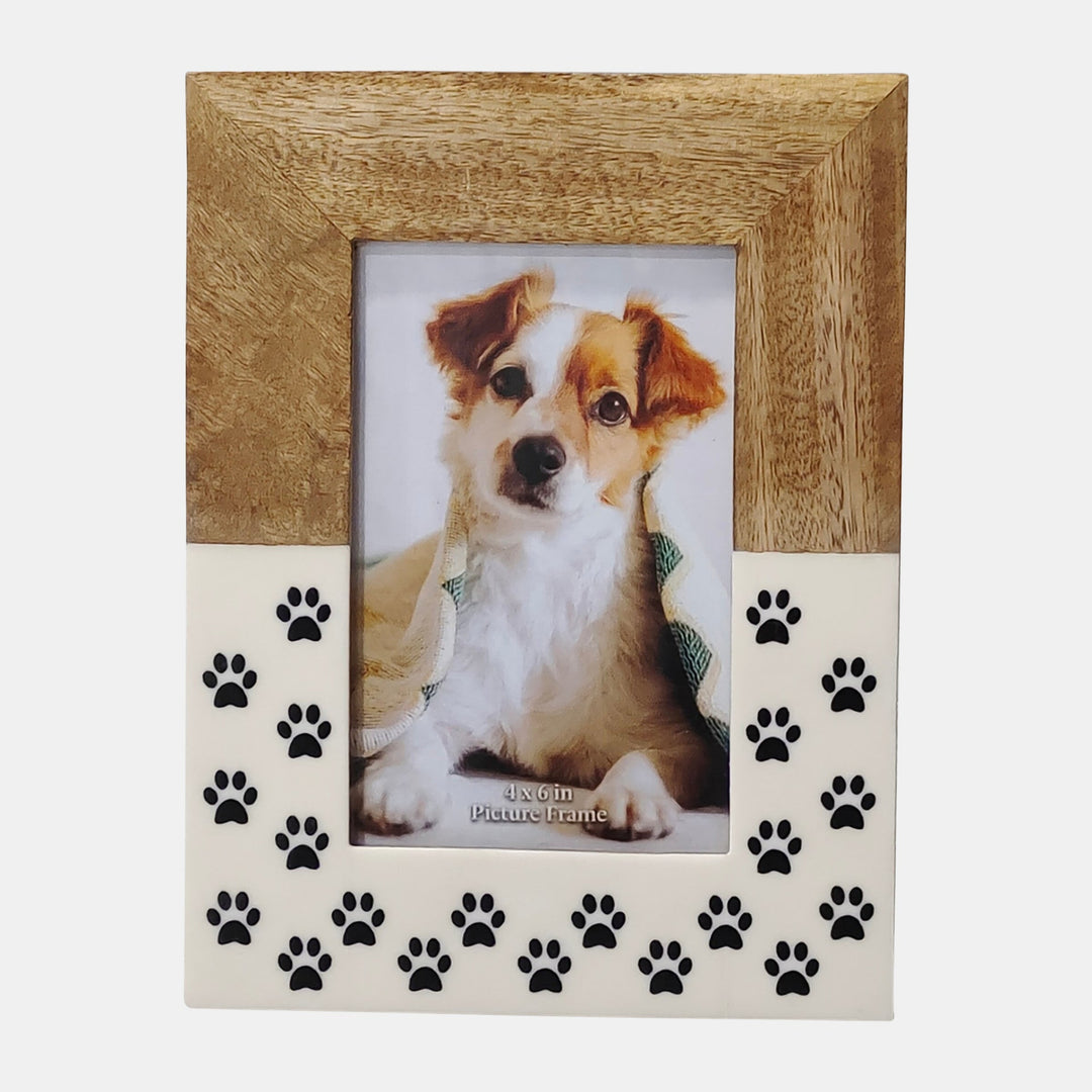 Wooden picture frame with paw prints and a photo of a dog inside