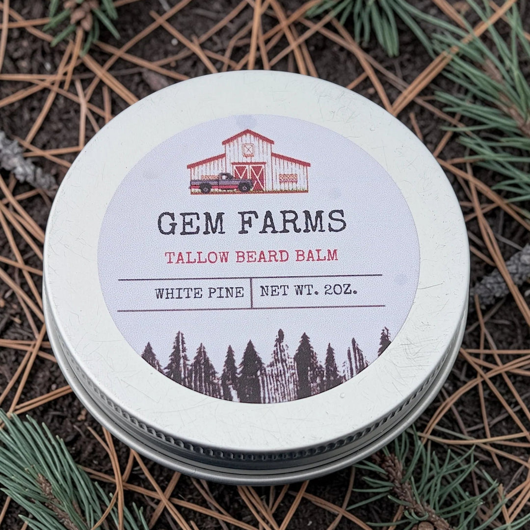 Tallow beard balm container with 'Gem Farms' label on a natural background