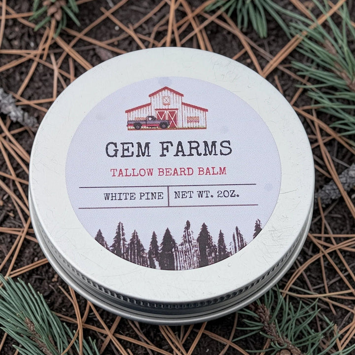 Tallow beard balm container with 'Gem Farms' label on a natural background