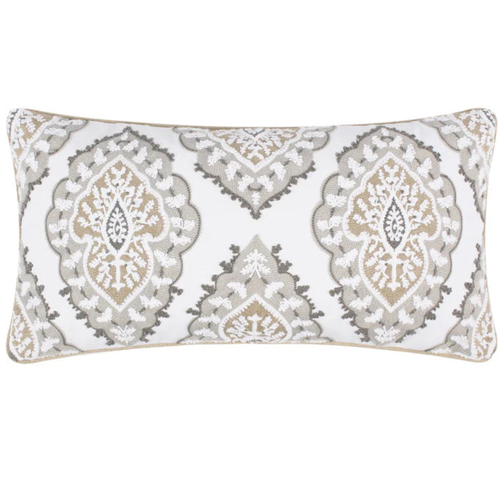 A rectangular lumbar throw pillow featuring a white background with a detailed beige, gray, and white damask pattern, finished with a thin beige piping border.