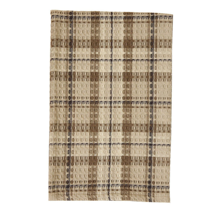 Plaid patterned rug with brown and beige colors on a white background