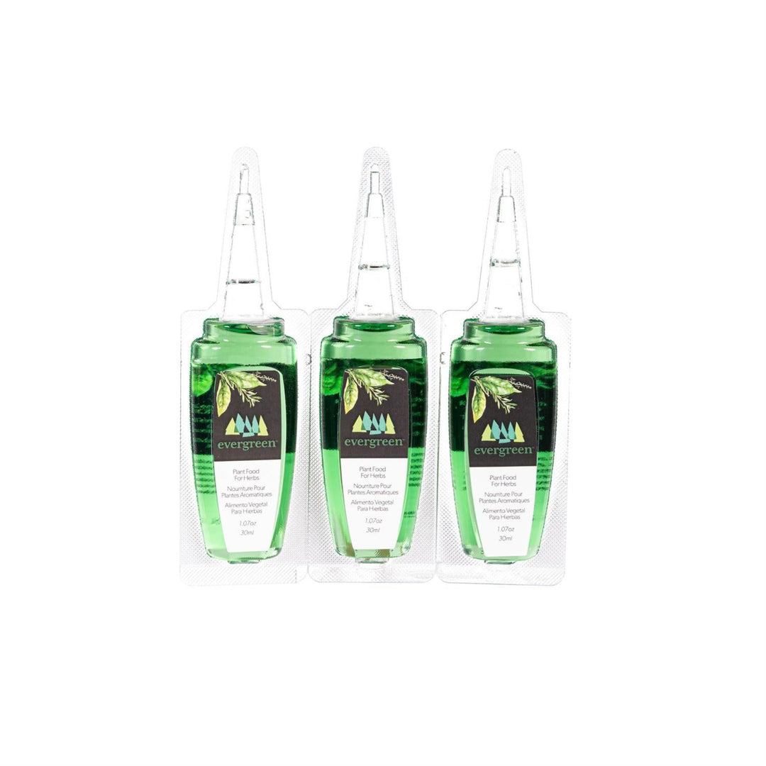 Three green bottles with labels on a white background