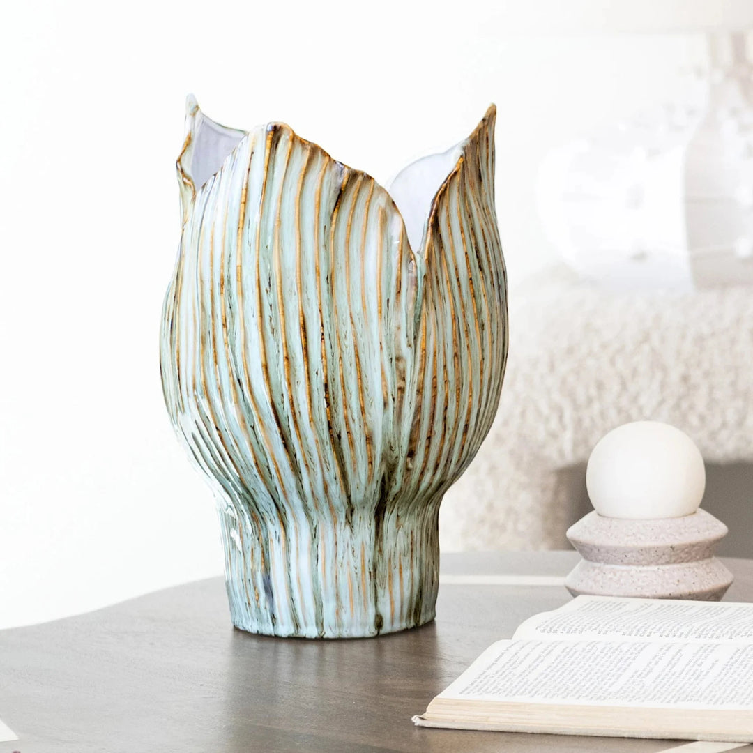 Decorative vase with wavy design on a surface