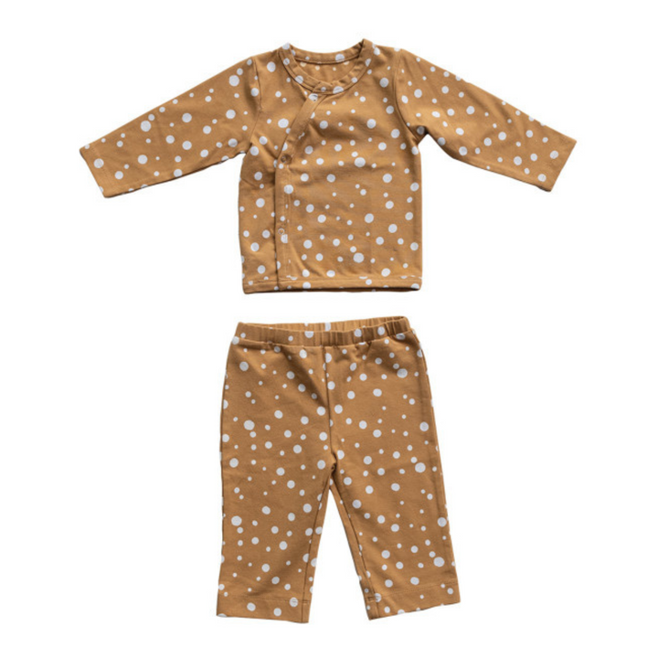 Children's pajama set with brown polka dot pattern on a white background