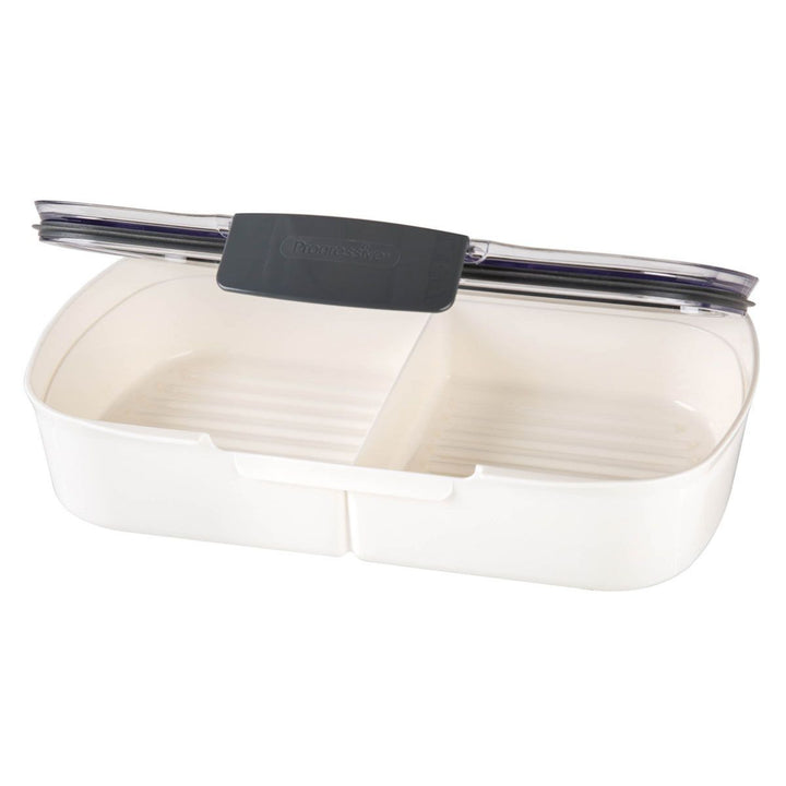 White and beige food container with a black lid on a white background