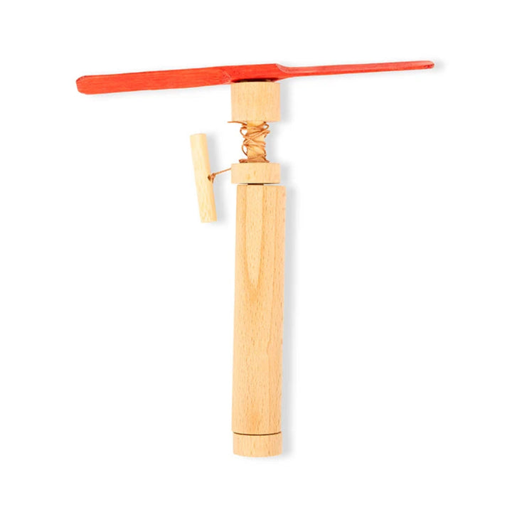 A wooden toy windmill or propeller with a light natural wood handle and a bright red blade, shown on a plain white background.