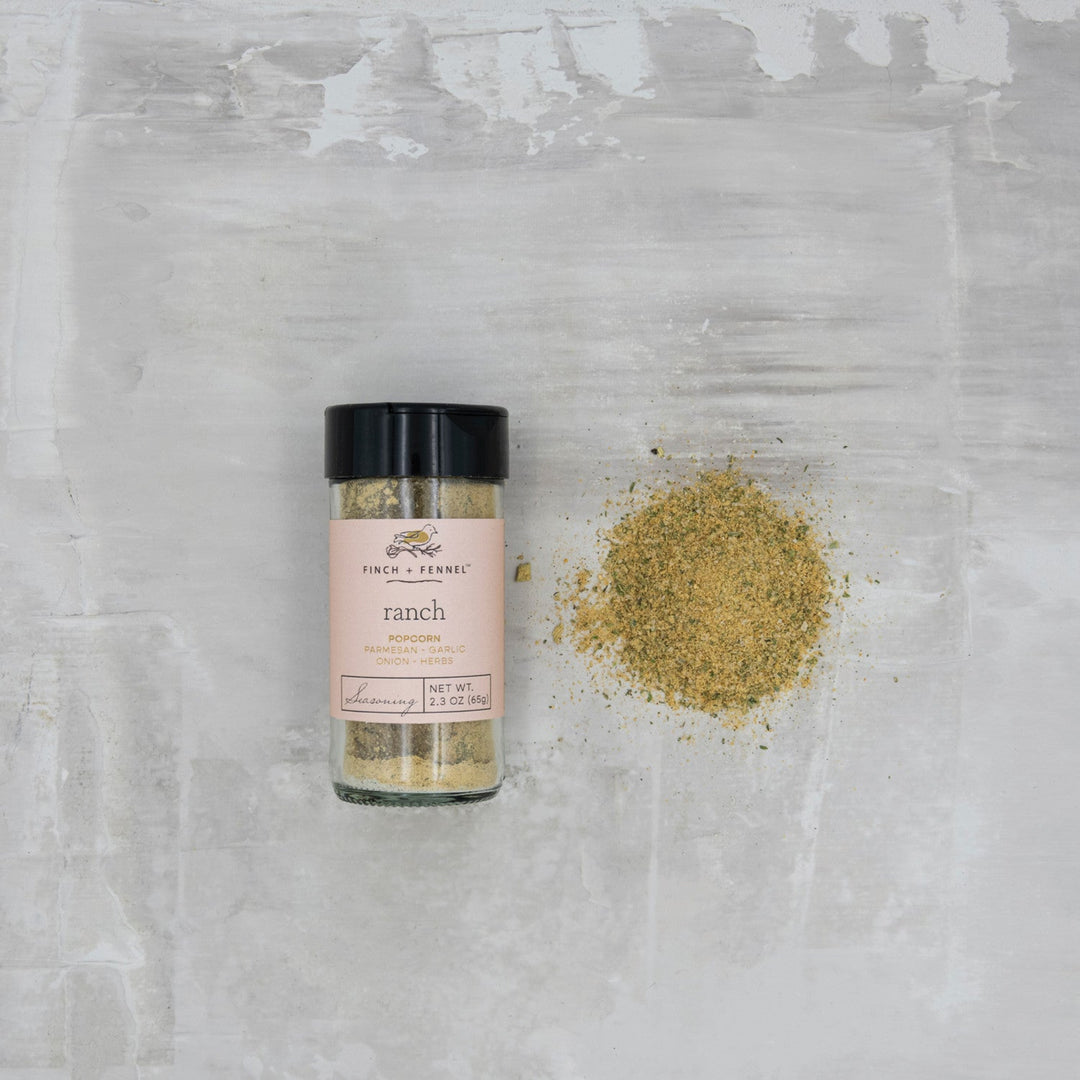 Spice container labeled 'ranch' on a textured gray surface