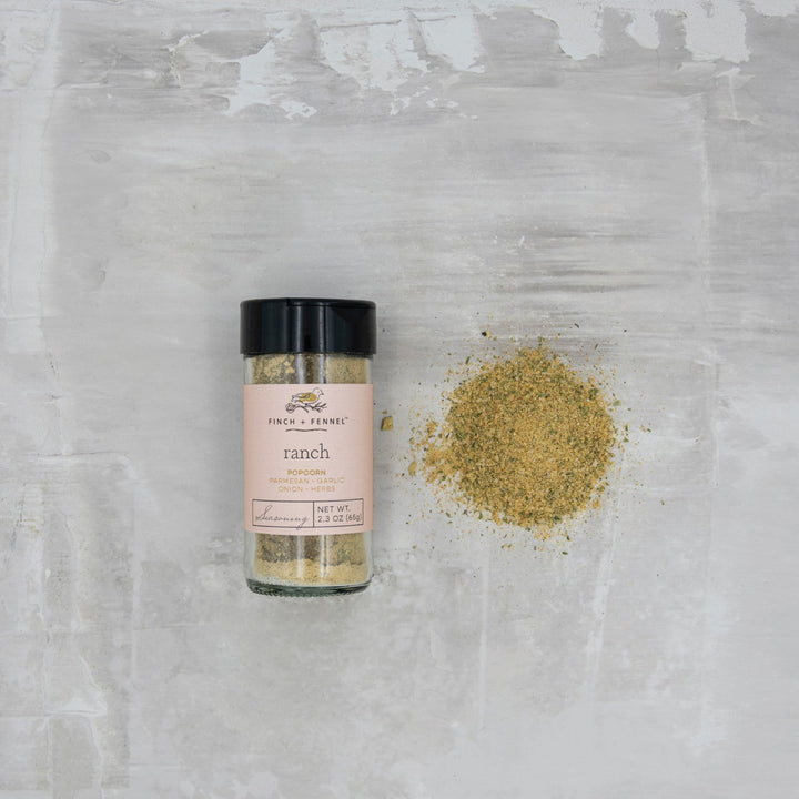Spice container labeled 'ranch' on a textured gray surface