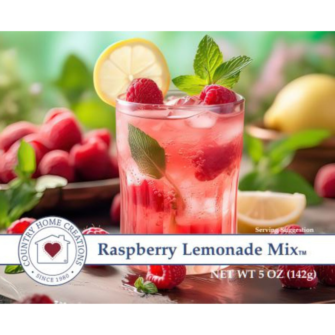 Raspberry lemonade mix packaging with a glass of lemonade and raspberries on a wooden surface.