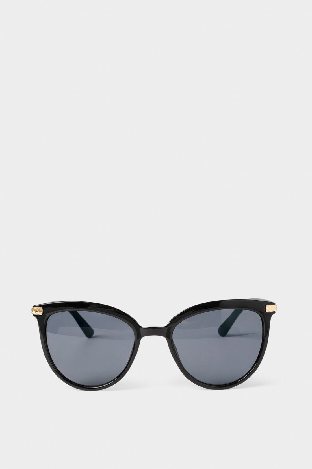 Black sunglasses with gold accents on a white background