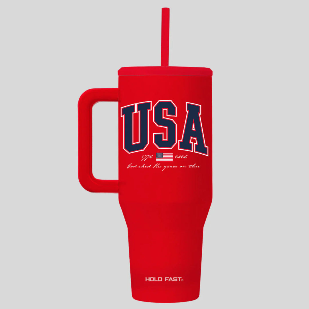 Red tumbler with 'USA' text and handle on a gray background