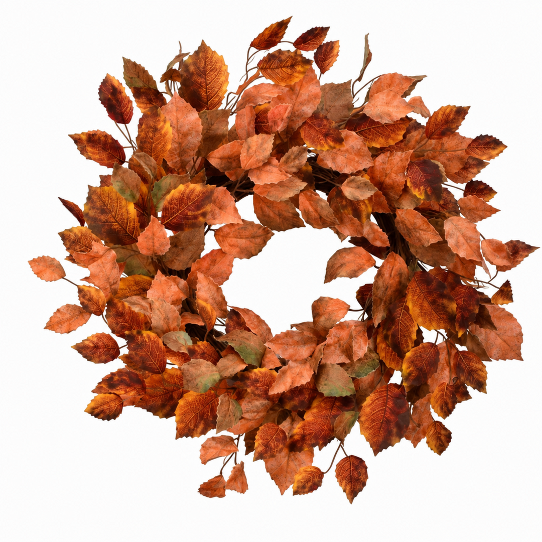 An artificial autumn leaf wreath made of faux leaves in shades of orange, brown, and muted green, isolated on a white background.
