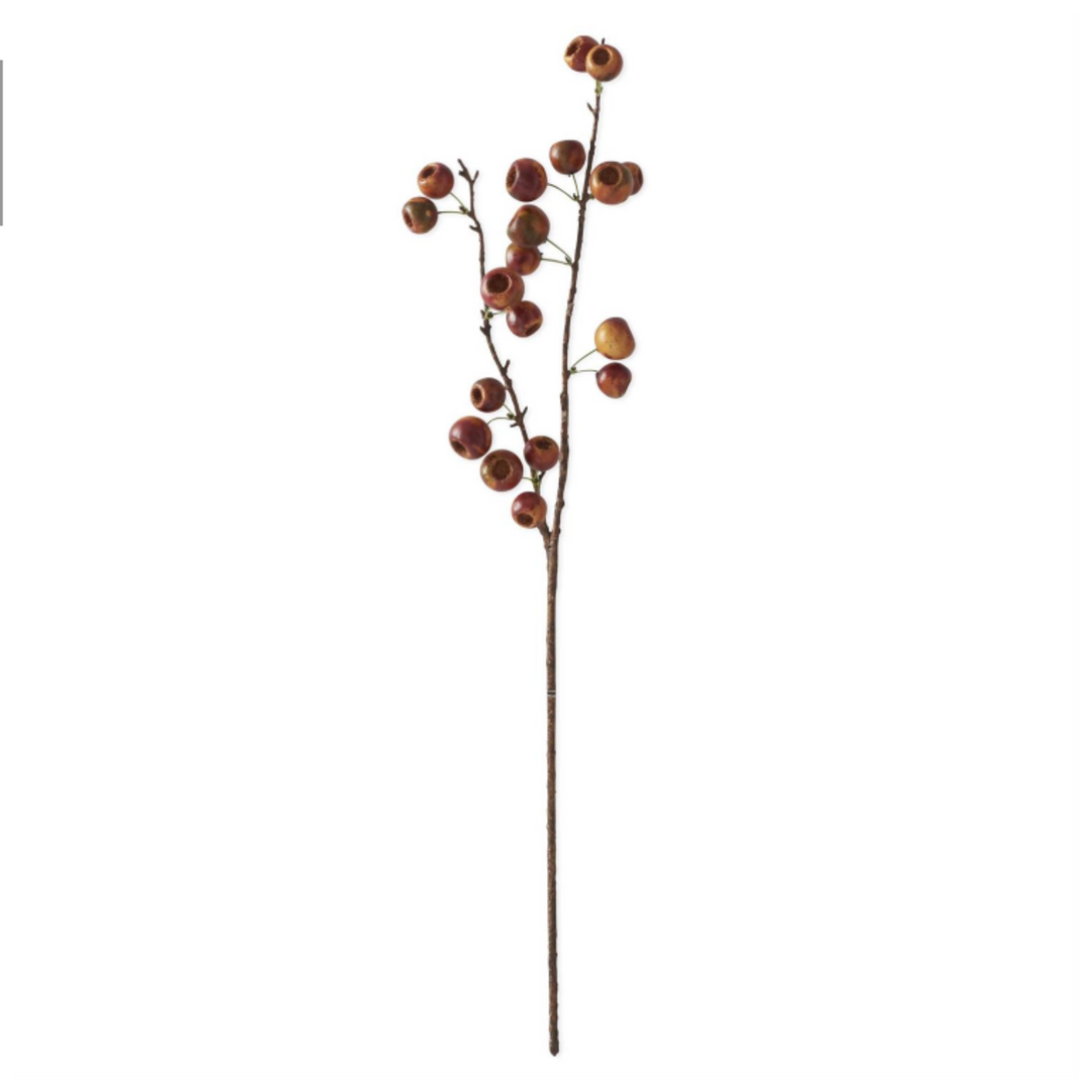 Artificial flower stem with berries on a white background