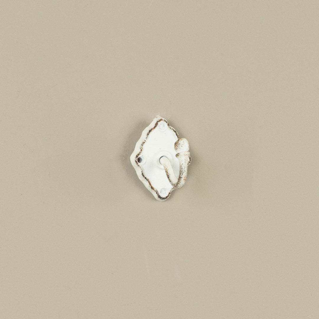 Decorative wall hook on a beige background