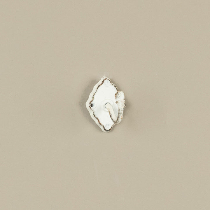 Decorative wall hook on a beige background