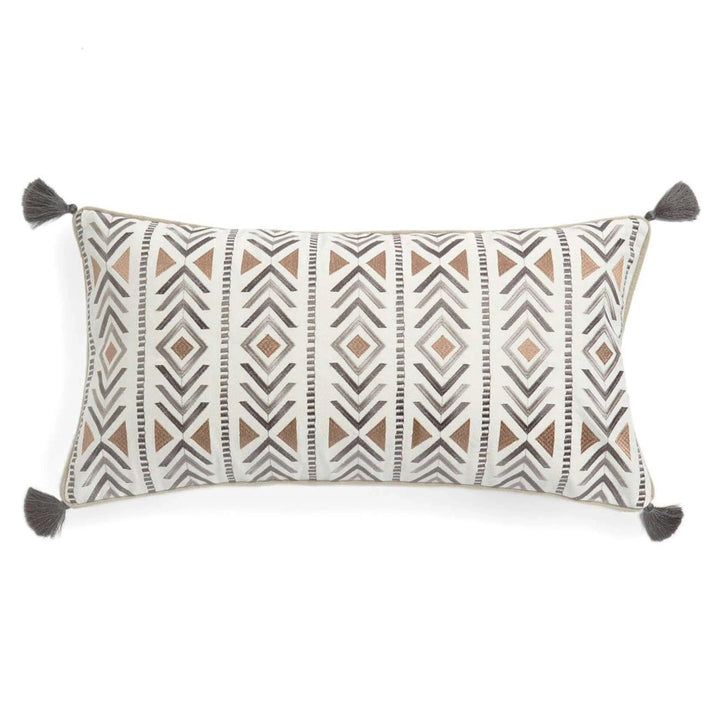 Decorative pillow with geometric pattern and tassels on a white background
