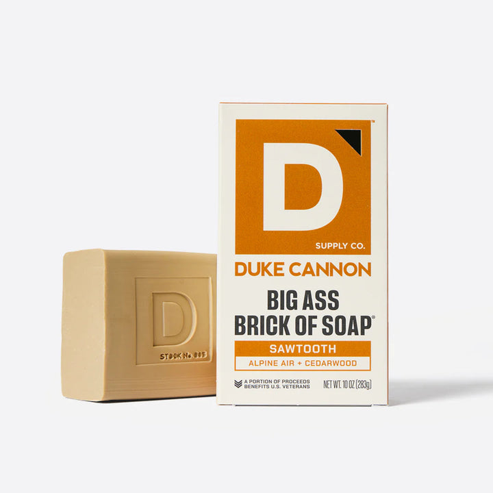 Bar of soap and its packaging with 'Duke Cannon' branding on a white background