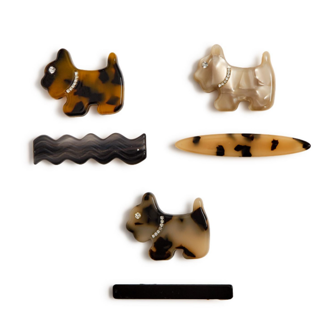 Set of dog-shaped hair clips on a white background
