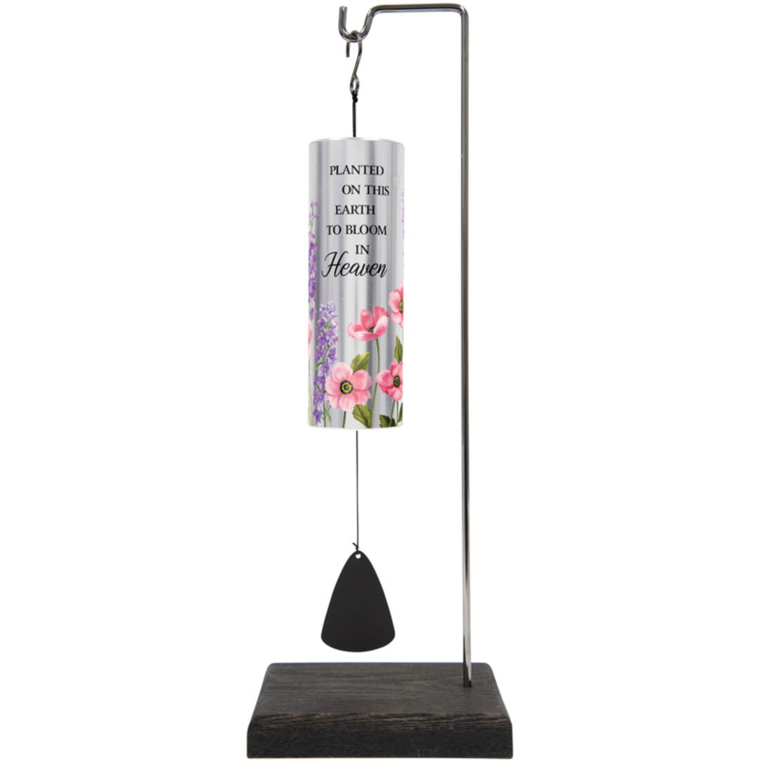 Decorative wind chime with floral design and text on a white background