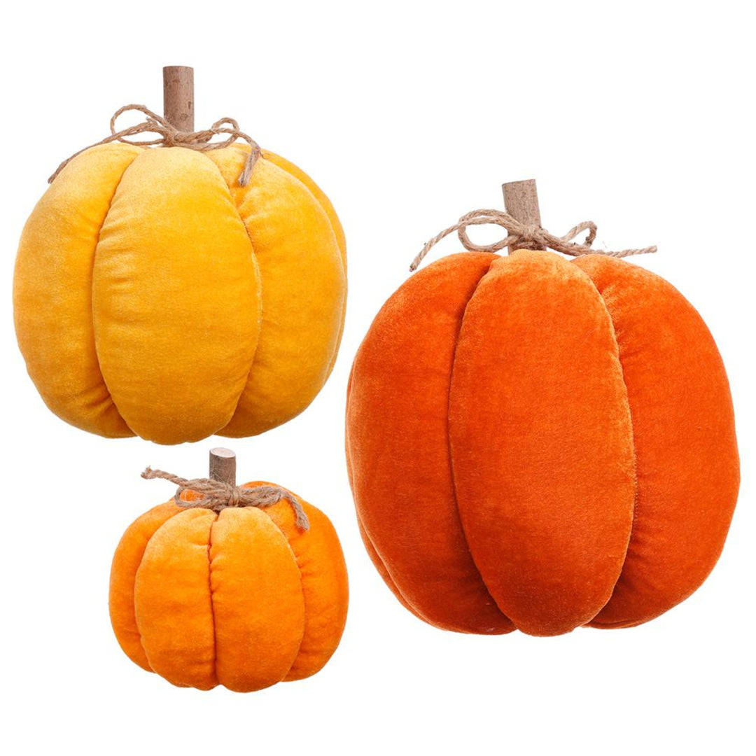 Three orange pumpkins with stems on a white background