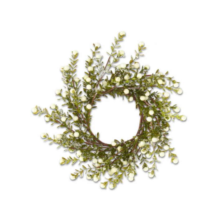 An artificial berry wreath with green leaves and small white berries on a brown vine, isolated on a white background.