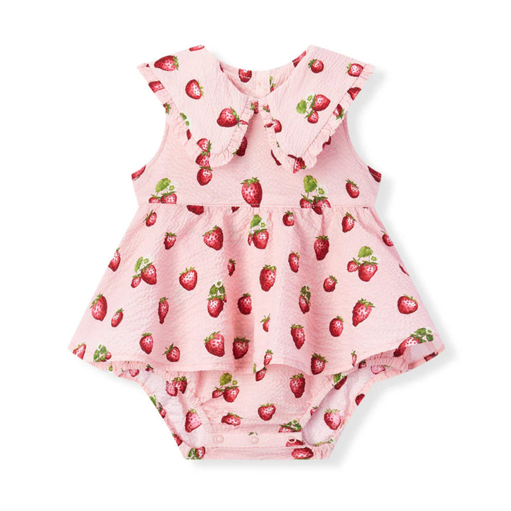 Pink baby romper with strawberry pattern on a white background
