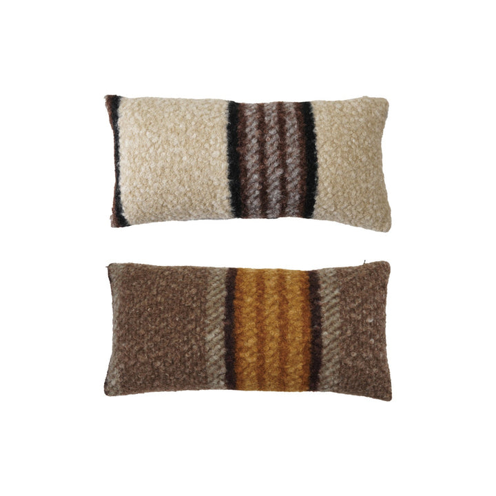 Two striped pillows with brown, beige, and orange colors on a white background