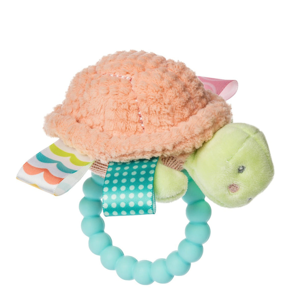 Plush turtle toy with a teething ring on a white background