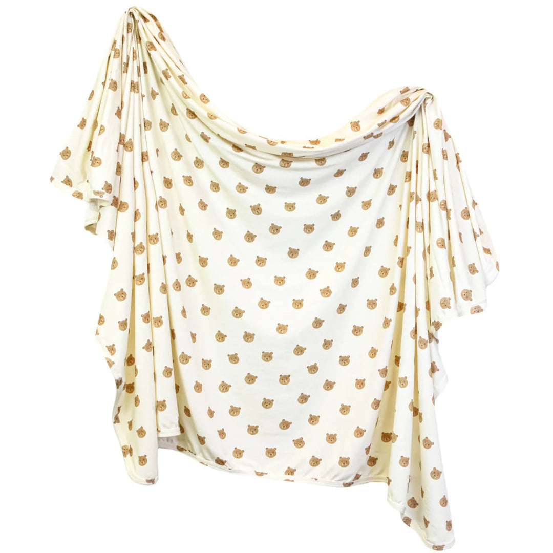 White scarf with gold leaf pattern on a white background