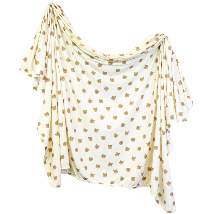 White scarf with gold leaf pattern on a white background