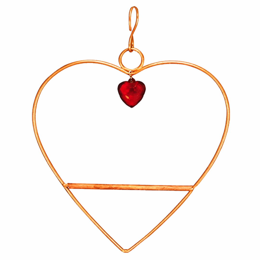 Heart-shaped copper ornament with a red heart pendant on a white background